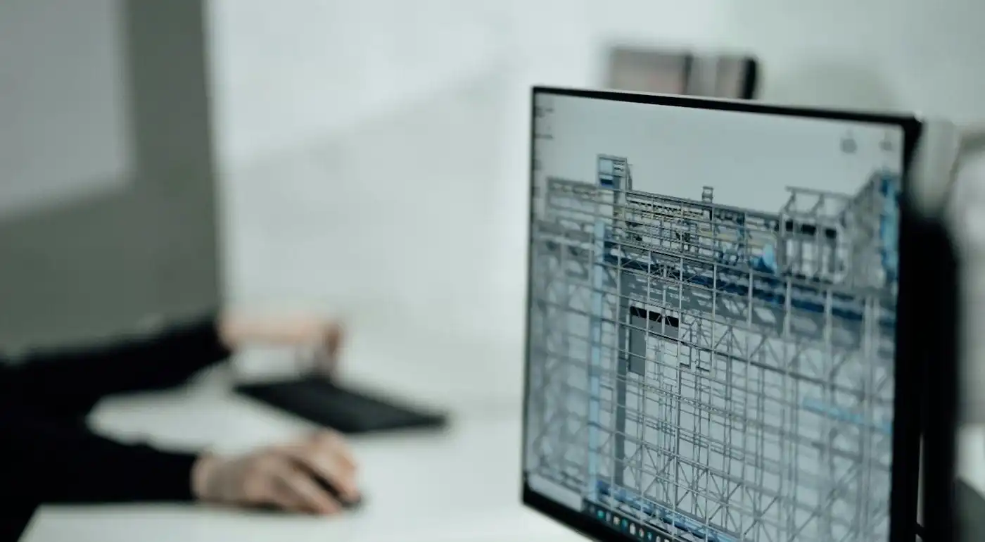 Designer working on a detailed 3D model on a computer screen
